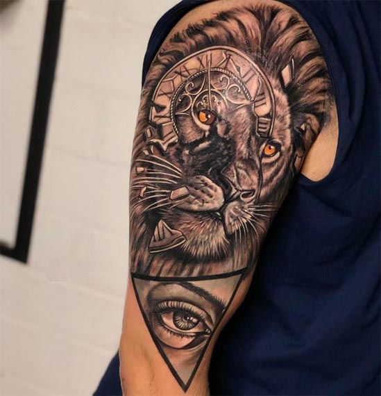 lion and realistic human eye tattoo design male bicep
