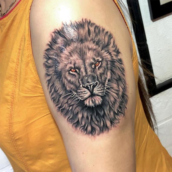 lion black and grey tattoo design female arm bicep