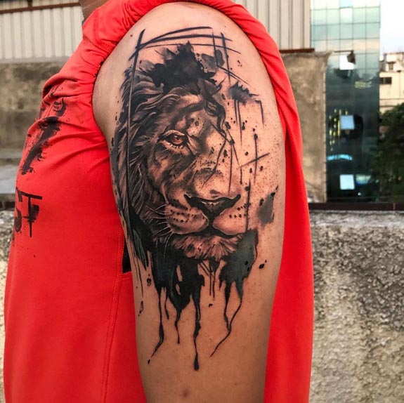 lion face abstract tattoo black and grey man hand bicep