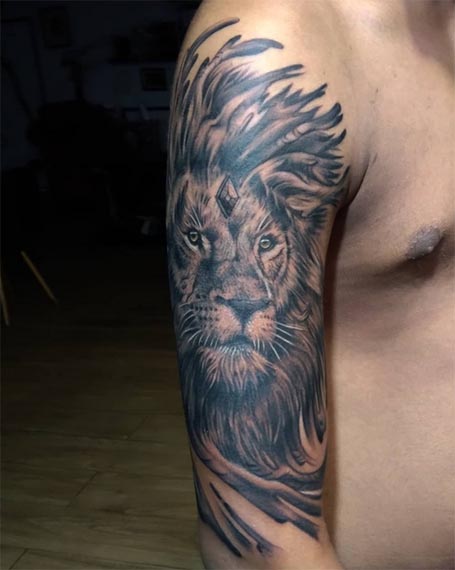 lion face tattoo large realistic male bicep half sleeve