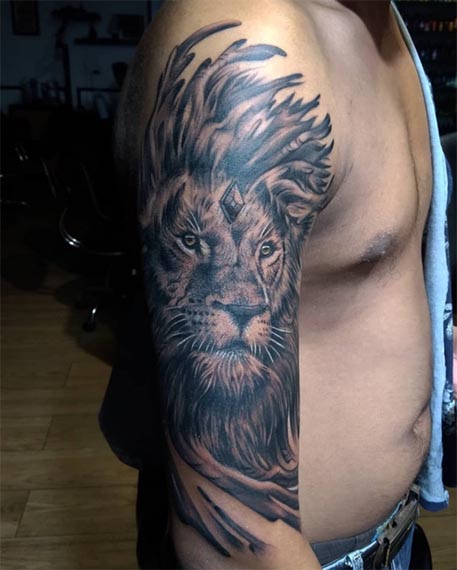lion face tattoo large realistic male bicep half sleeve