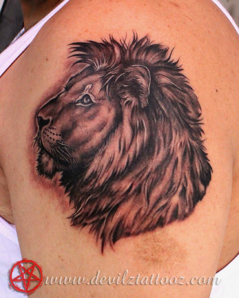 lion tattoo idea on bicep