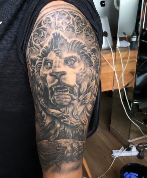 lion with flowers tattoo design men arm bicep