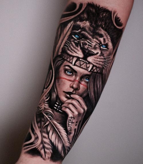 woman with lion headdress tattoo female hand forearm