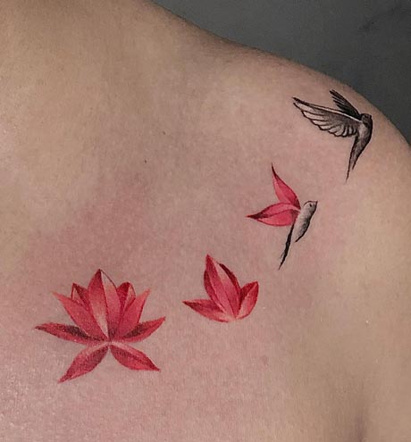 blooming red lotus with hummingbird tattoo design female collarbone