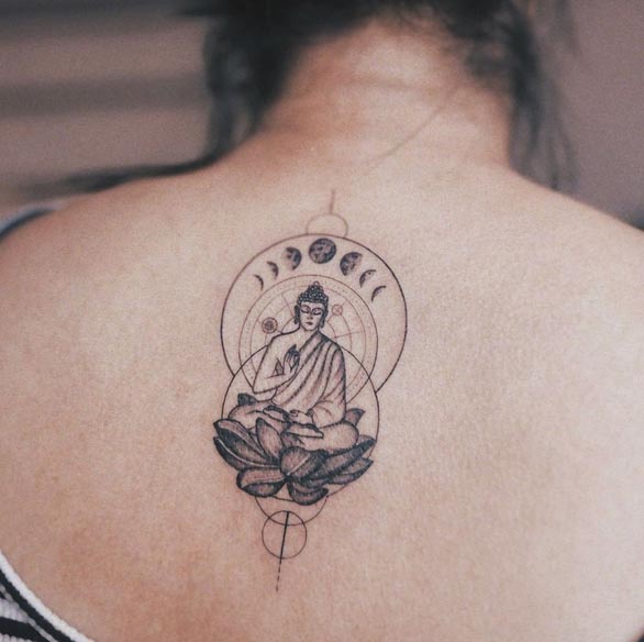 buddha sitting on lotus behind circles and moon phases tattoo female back