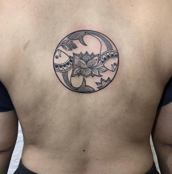 lotus 2 fishes yin yang in circle tattoo design female back