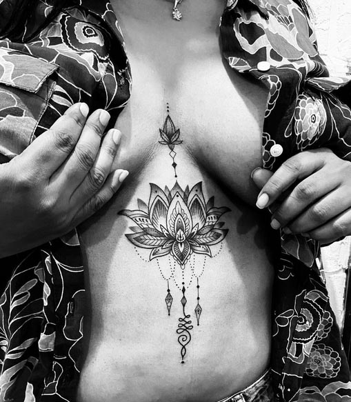 lotus mandala unalome tattoo design ornamental female sternum black and grey