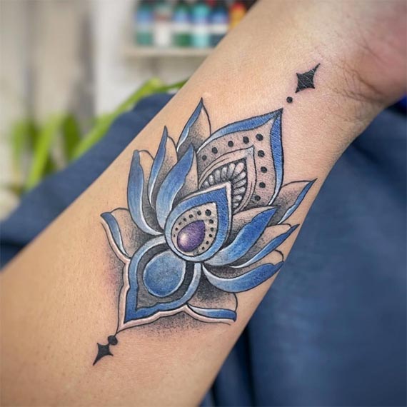 lotus tattoo design color blue female forearm