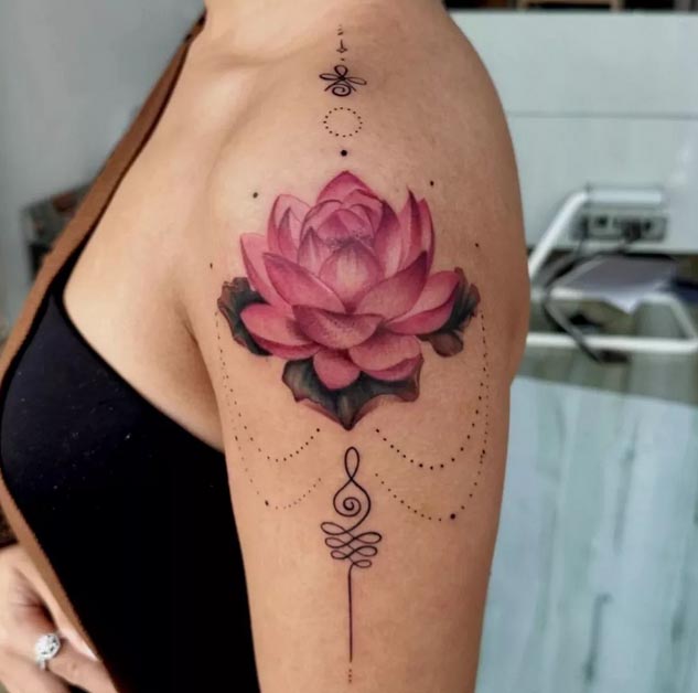 purple lotus unalome ornamental tattoo design female shoulder bicep