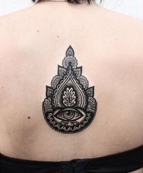 mandala eye tattoo on female back