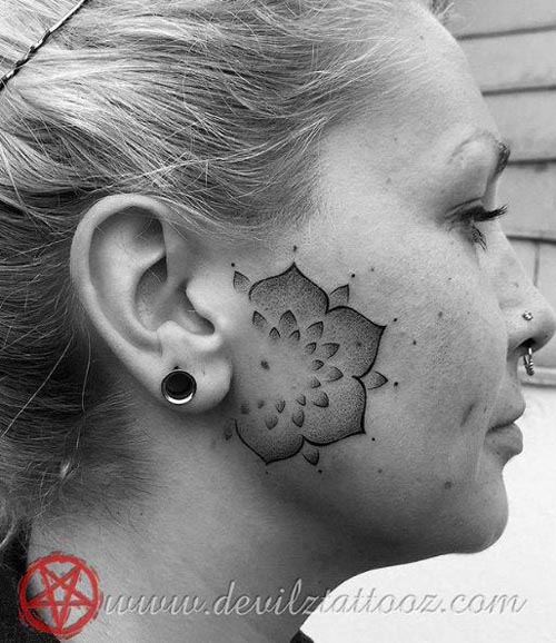 mandala tattoo on lady face