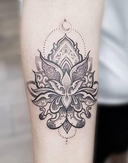 mandala tattoo and flower on hand