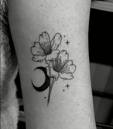 cherry blossom flower crescent moon tattoo design female bicep