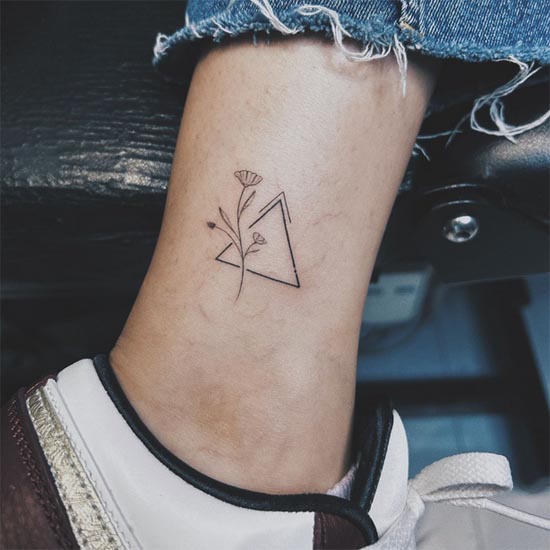 floral with triangle fineline tattoo design female leg