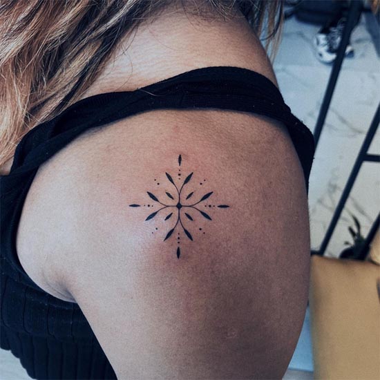 mehndi style minimalist tattoo design female shoulder
