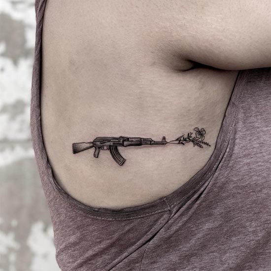 minimalist ak 47 gun tattoo design side