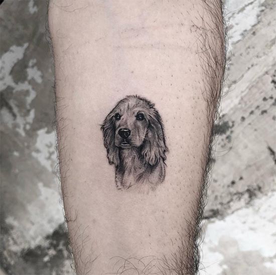minimalist dog portrait tattoo design male hand forearm