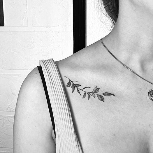 minimalist leaves tattoo design girl collarbone