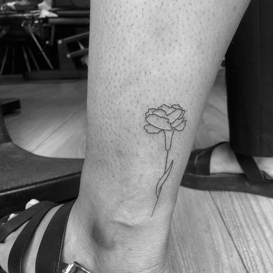 minimalist rose flower tattoo design fineline female leg