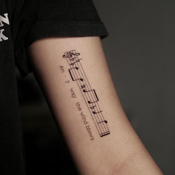music notes quote any way the wind blows tattoo female forearm