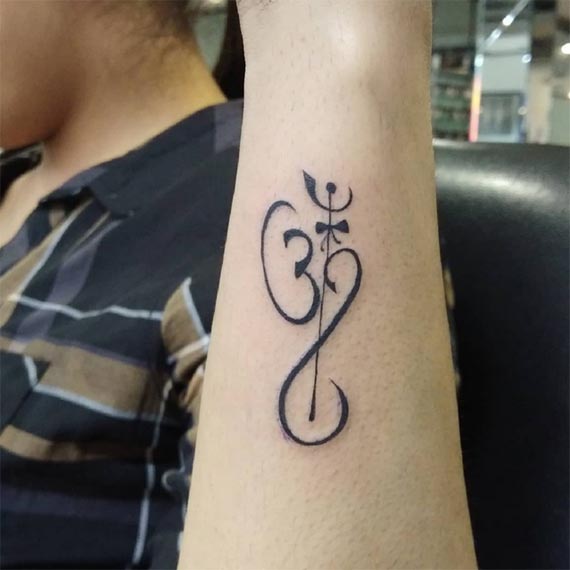 om trishul damru infinity tattoo forearm woman