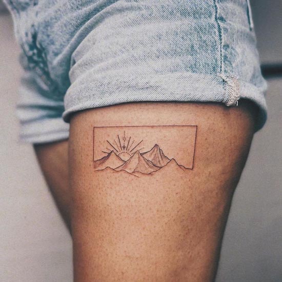 small mountain sun fineline tattoo female leg thigh