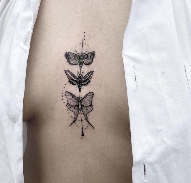 3 moth with geometric pattern tattoo female sternum