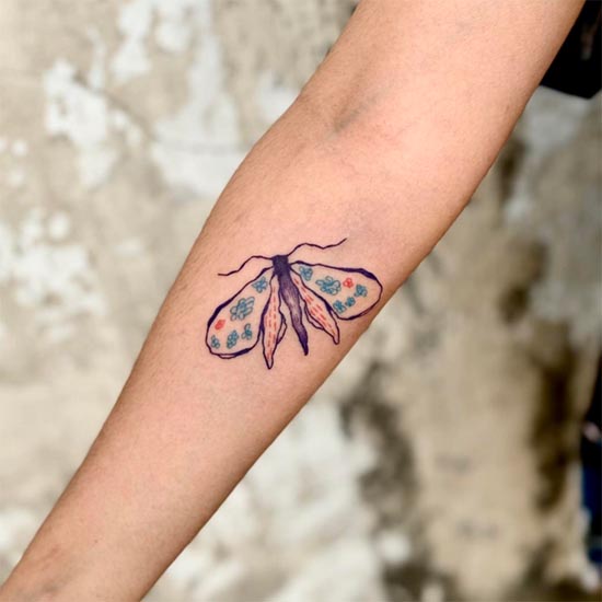 moth illustration tattoo design female hand forearm