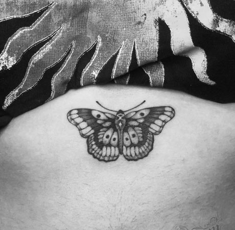 moth tattoo design female stomach