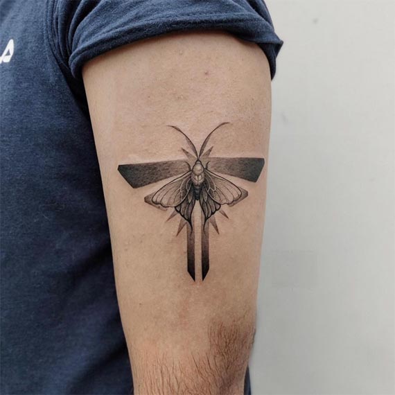 moth tattoo design new school style male hand bicep