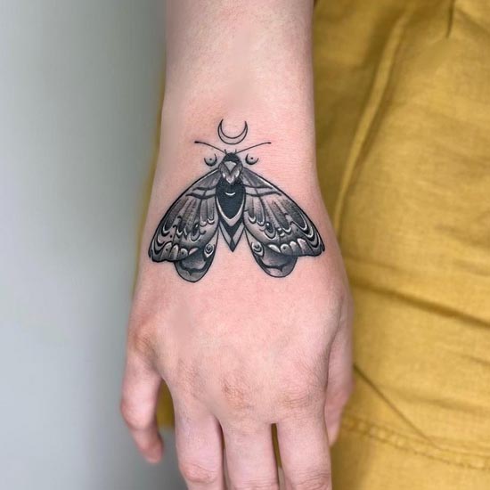 moth tattoo dotwork female hand