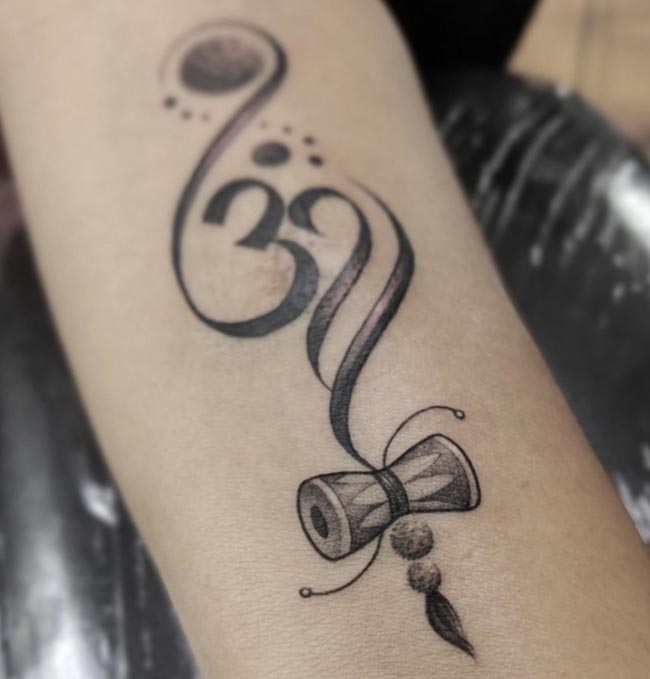 infinity om damru rudraksha tattoo female forearm