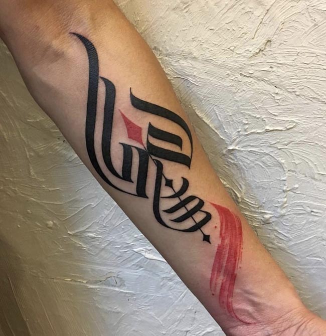 trishul om and red brush stroke tattoo tribal male forearm