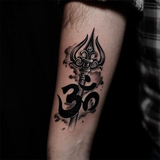 with cloud like background om trishul tattoo design male forearm