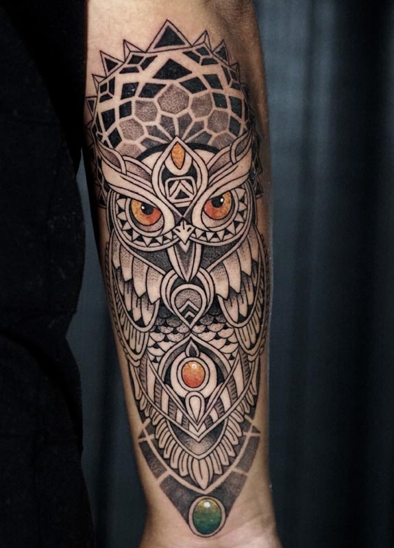 mandala style owl tattoo design male forearm