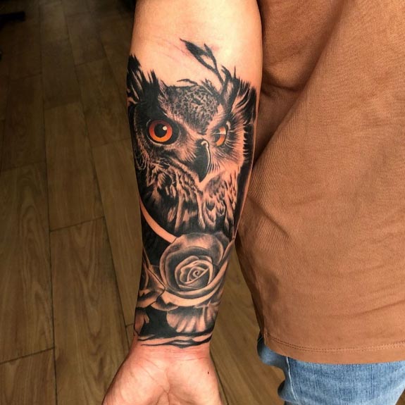 owl rose tattoo design male forearm black and grey