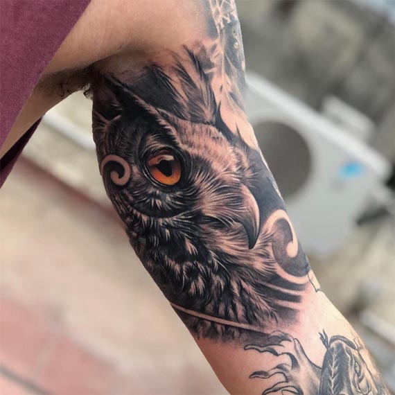 owl side face tattoo design black and grey male inner bicep