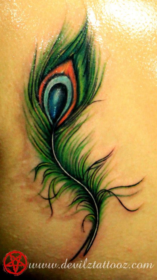 peacock feather color tattoo idea
