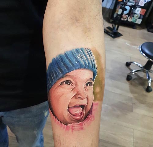 child portrait tattoo on Forearm