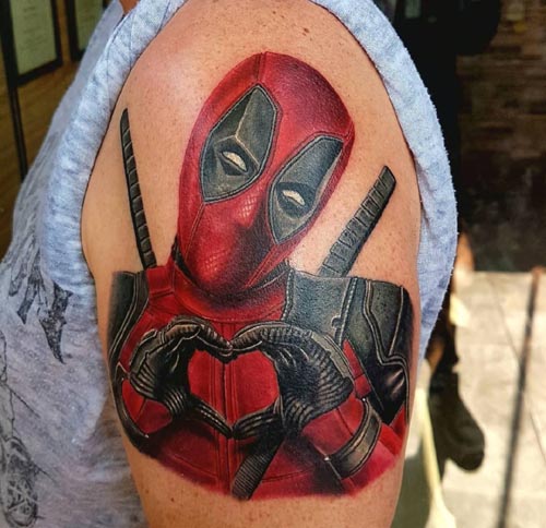 deadpool portrait tattoo on Bicep