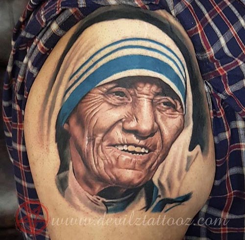 mother teresa portrait tattooon Bicep