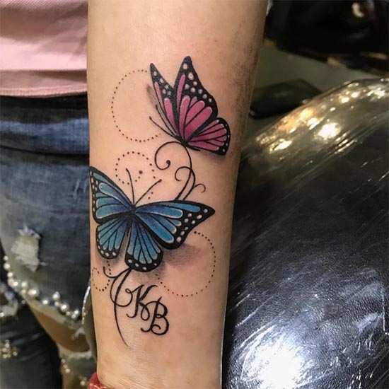 2 butterfly with name initials tattoo design female hand forearm
