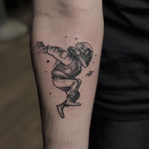 astronaut universe tattoo design male hand forearm