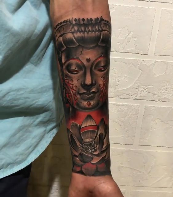 buddha face with lotus tattoo design male hand forearm