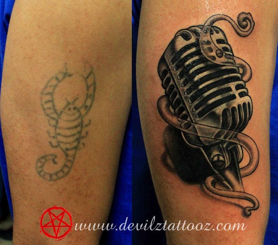 cover up tattoo on a musician old school microphone tattoo