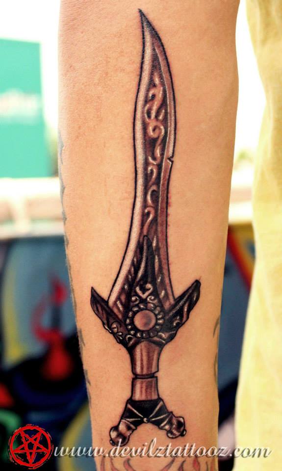 dagger tattoo on arm