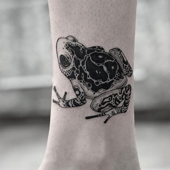 frog tattoo female leg above ankle black and grey