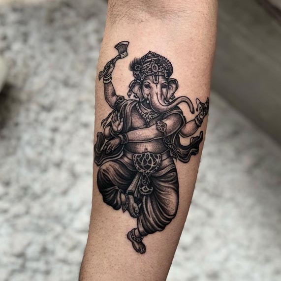 ganesha tattoo stippling black and grey male hand forearm