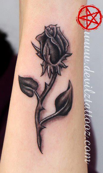 black rose tattoo on hand